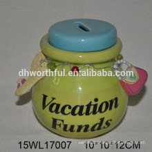 Green ceramic piggy bank with chain decorations